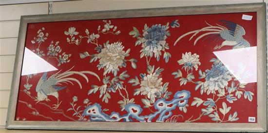 A Chinese embroidered silk picture of phoenix, peonies and rockwork 56 x 129cm excl. frame